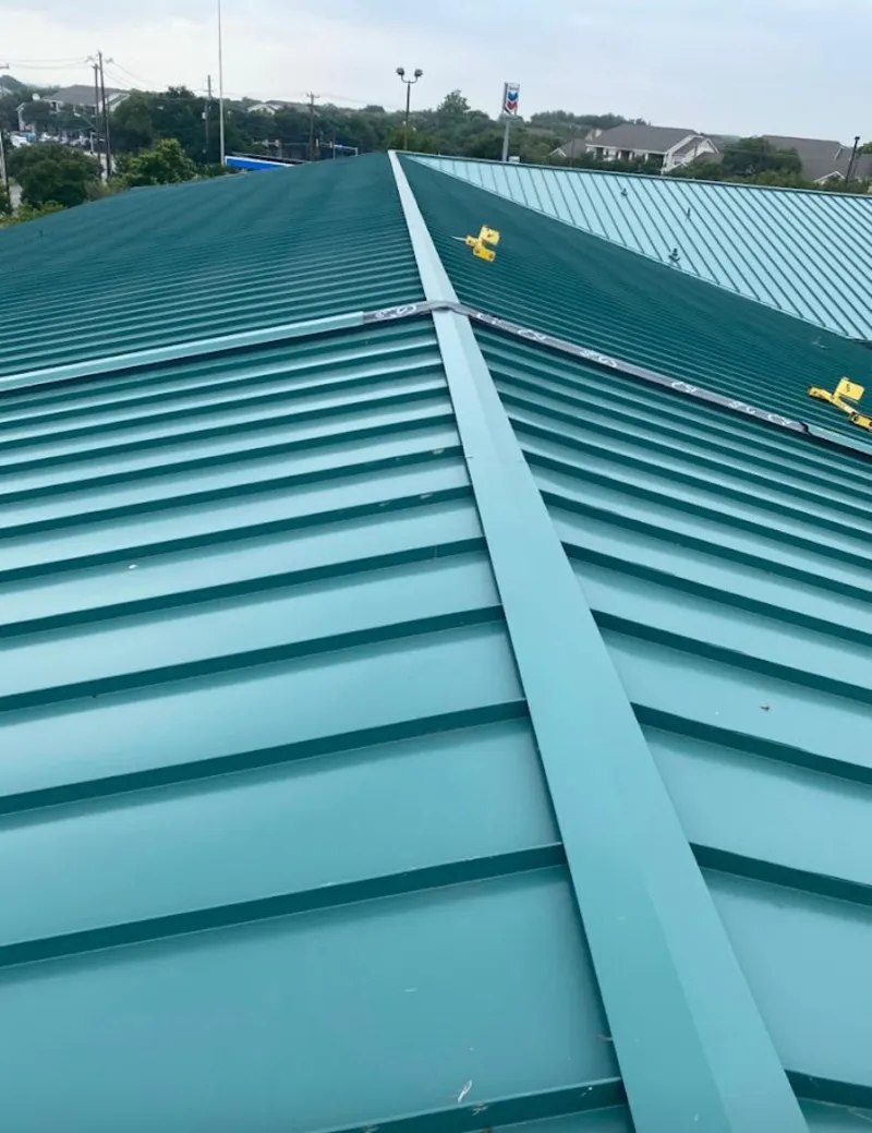 Green commercial metal roof ridge and valley for Metal Roof Repair in Walton